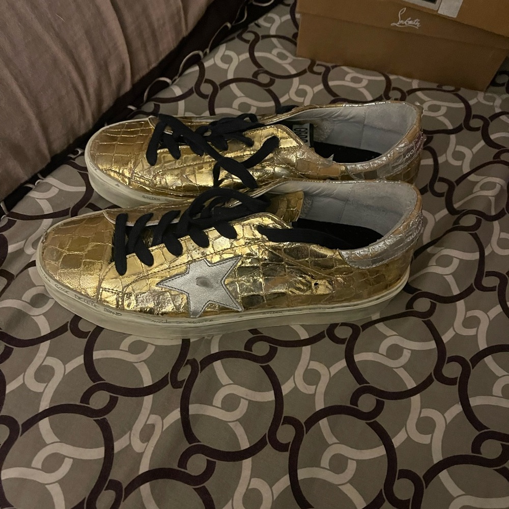 Golden Goose shiny gold sneakers